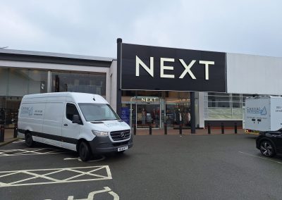 Central Shop maintenance van parked outside NEXT store entrance for a facilities site visit