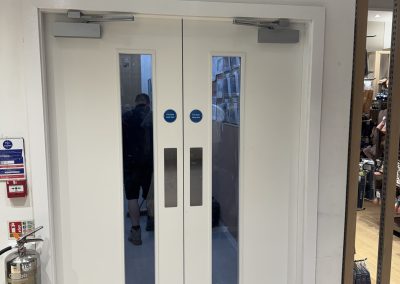 Wide view of the new fire door set and overhead closers fitted by CSM at Next, Oxford Street, London
