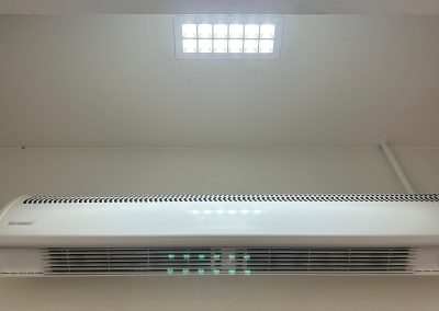 New ceiling lighting, air conditioning and air curtain heater above the entrance at Pandora Nuneaton