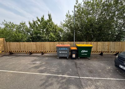 Recycling bins in front of new timber boundary fence at vet surgery