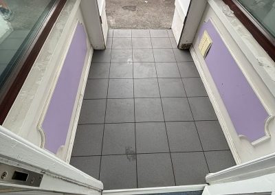 Open entrance doors with street view at vet surgery Blackwood