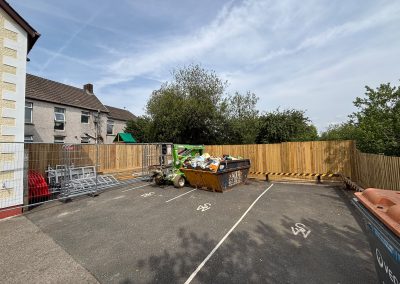 Wide view of rear car park with new timber fence at vet surgery