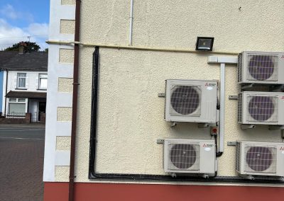 Repainted side wall with air conditioning units at vet surgery